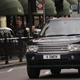 A photo of a black Range Rover driving through traffic in London.